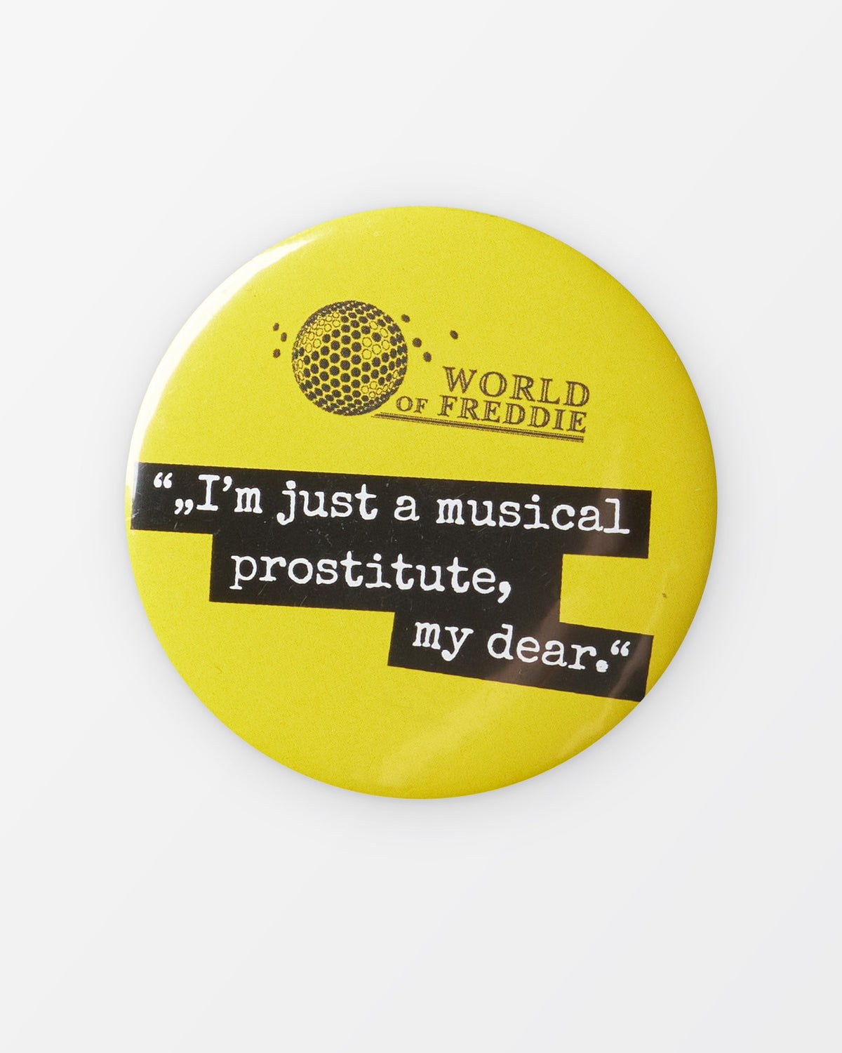 Placka s citátem „I’m just a musical prostitute, my dear.“