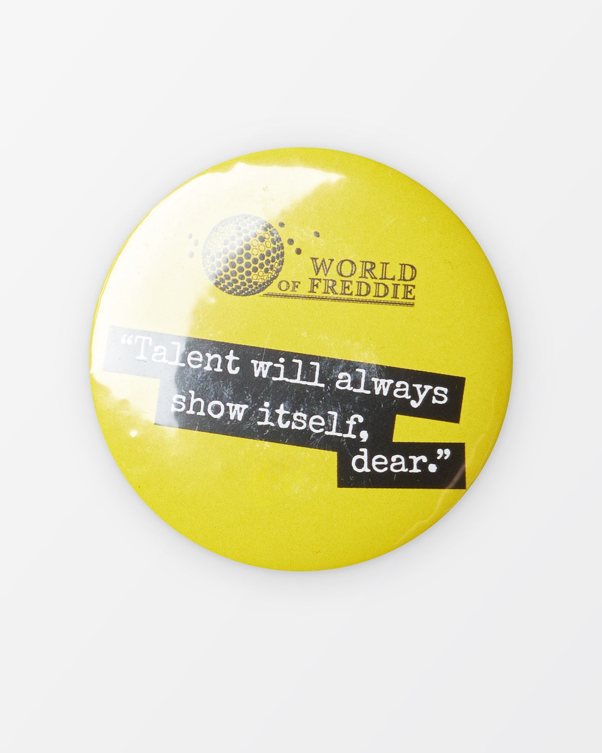 Placka s citátem „Talent will always show itself, dear.“
