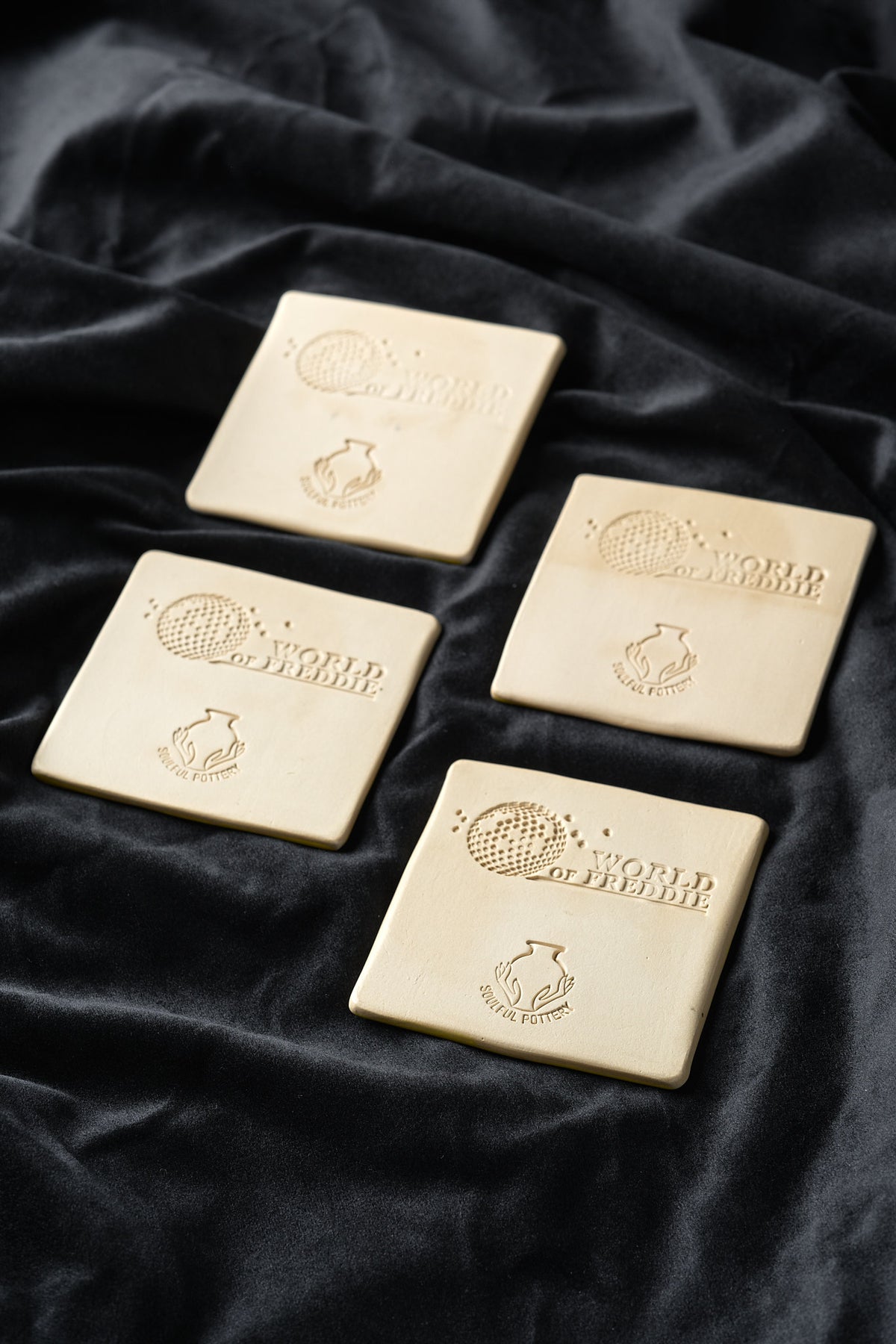 Underside of the tiles with the stamped World of Freddie logo